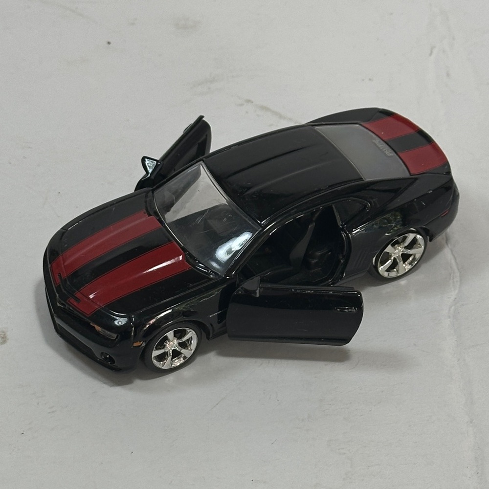 Sleek Camaro Black Model Car with Red Stripes